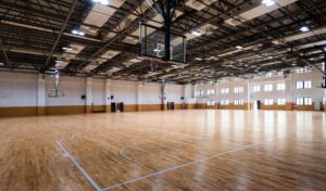 An indoor basketball court with vinyl flooring