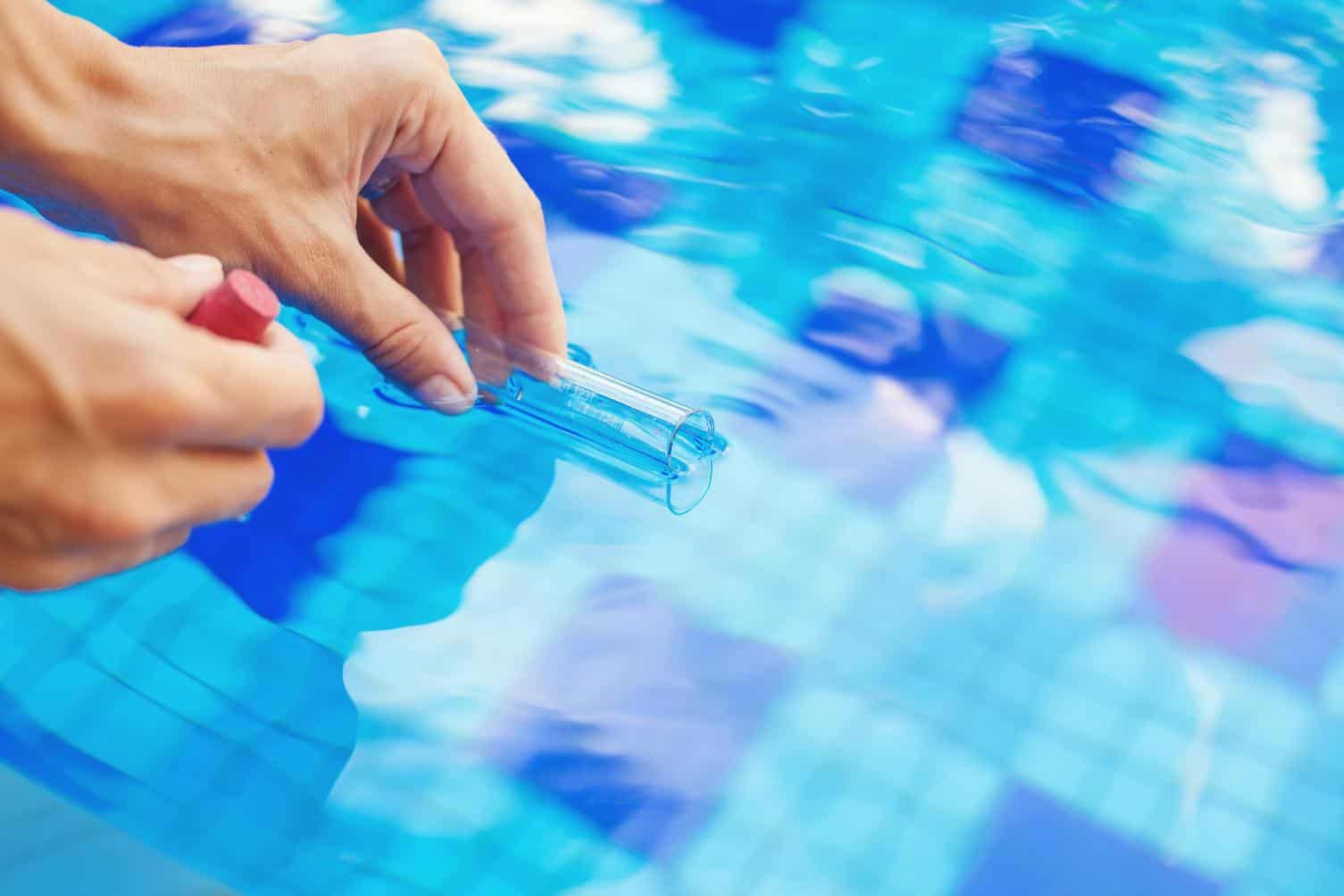 Taking a sample of swimming pool water