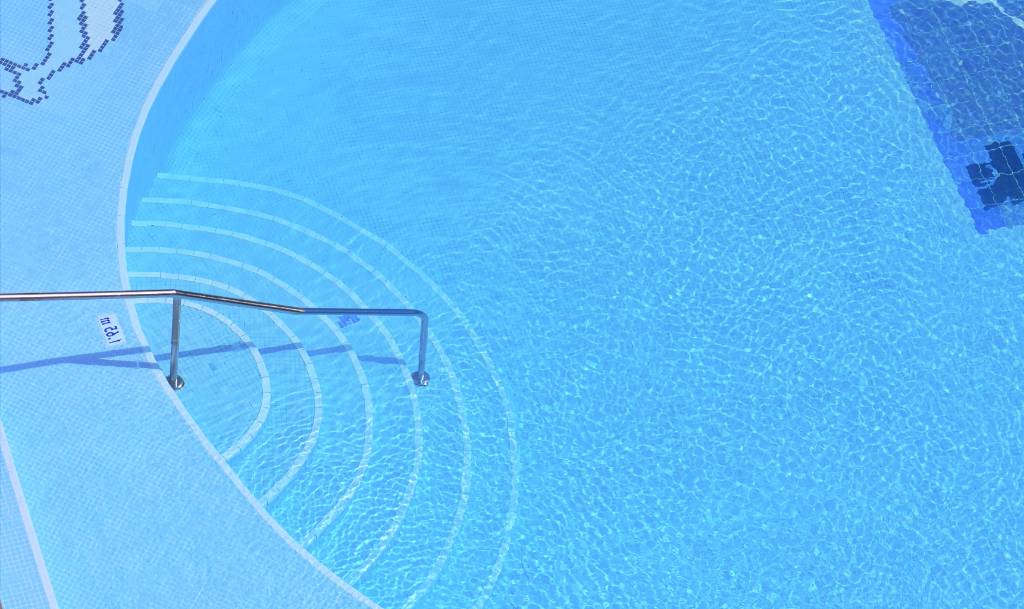 A pristine pool ready for use after a resurfacing project by pool resurfacing contractors