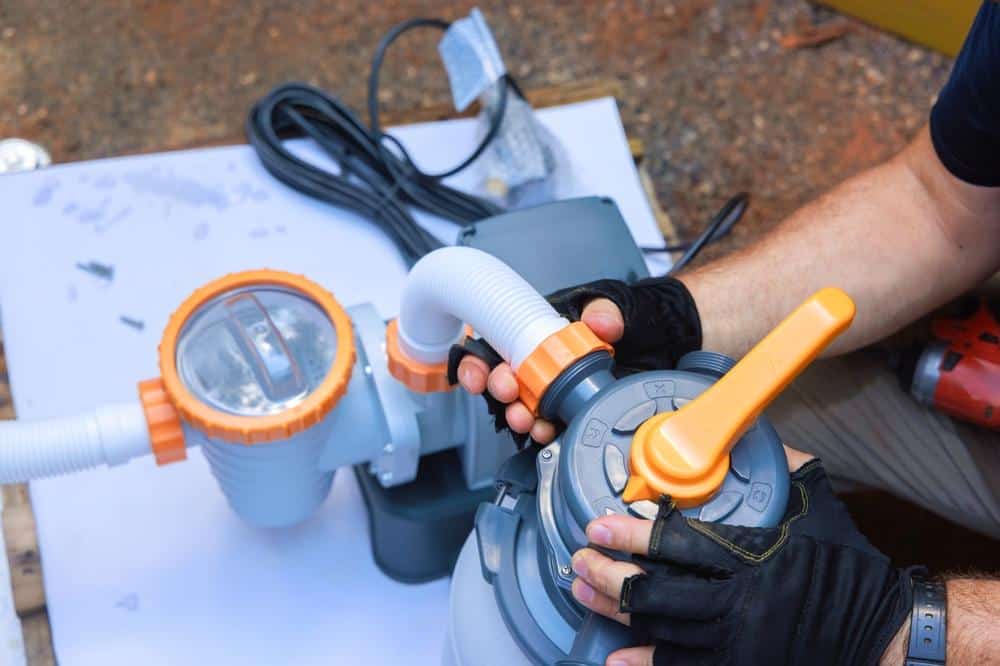 A professional pool contractor installing pool pump equipment